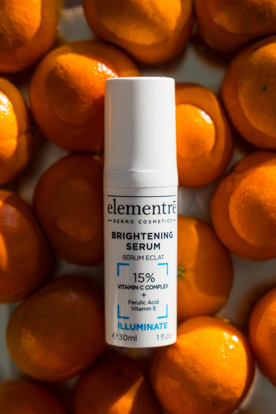 elementrē 15% Vitamin C Brightening Serum with oranges and Vitamin C graphic